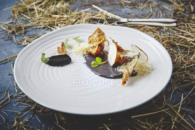 Gourmet dish with baked pear and sauce — Stock Photo