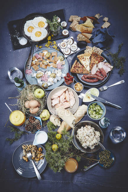 Tasty dishes on dark tablecloth — Stock Photo