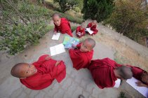 Novice monks children studying — Stock Photo