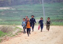 Children smiling and running — Stock Photo