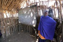 Teacher in School of Maasai tribe — Stock Photo