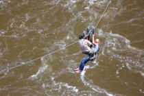 Travelers  on the ropes, flying on ropes across the  Zambezi river — Stock Photo