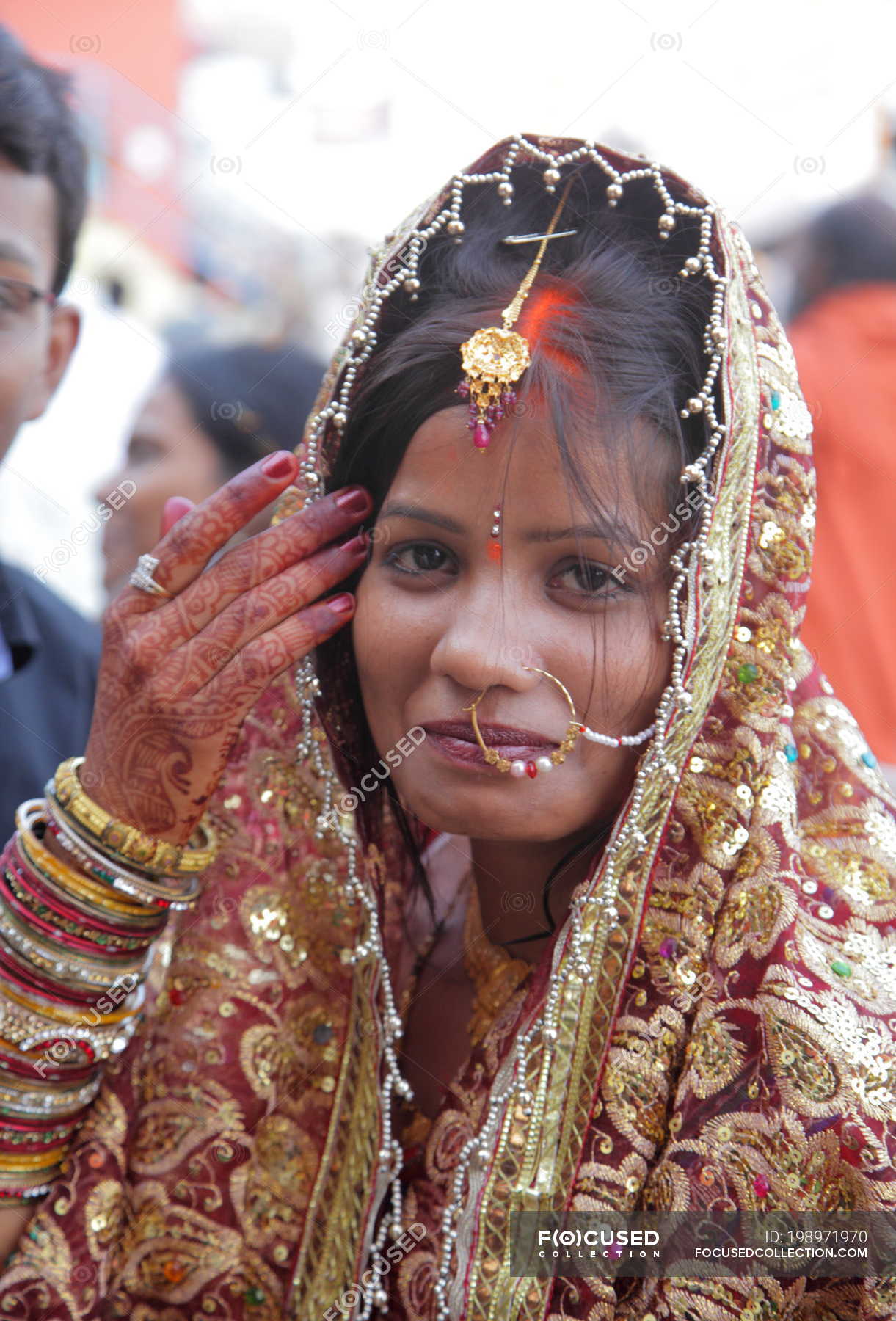 Indian Hindu bride closeup in wedding ceremony — golden, silk - Stock Photo  | #198971970