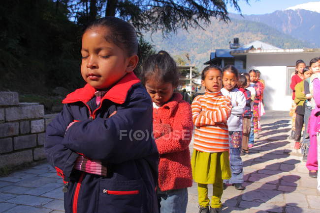 Little girls on morning prayer — Stock Photo