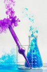 Bottles with color smoke — Stock Photo