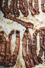 Cooked crispy bacon strips — Stock Photo