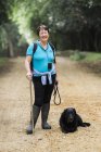 Female hiker with her dog. — Stock Photo