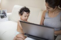 Mother and son using computer — Stock Photo