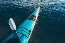 Empty sea kayak on calm waters — Stock Photo