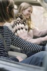 Young couple driving in their car. — Stock Photo