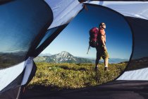 View from tent of man hiking — Stock Photo