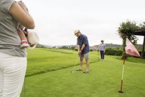 Japanese Family on a golf course. — Stock Photo