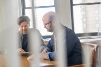 Business colleagues in an office talking — Stock Photo