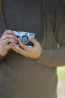 Man holding a vintage camera. — Stock Photo