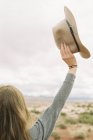 Woman holding a hat — Stock Photo