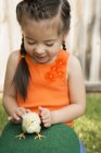 Child with a baby chick — Stock Photo