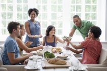 Family gathering for a meal. — Stock Photo