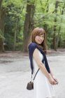 Woman in a Kyoto park posing — Stock Photo