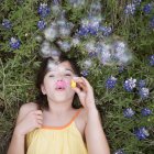 Girl blowing bubbles in the air. — Stock Photo