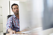 Man working in an office — Stock Photo