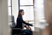 Woman working in an office — Stock Photo