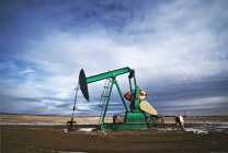 Pump jack at drilling site for oil — Stock Photo