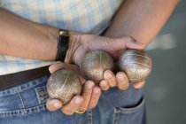 Boules player holding metal boules — Stock Photo