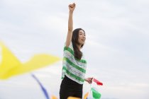 Woman hoding paper flags — Stock Photo