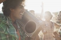 People on the open road with a boombox. — Stock Photo