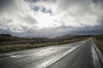 Road through a deserted landscape — Stock Photo