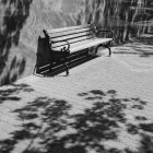 Bench on a downtown sidewalk — Stock Photo