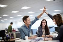 Three people in an office — Stock Photo