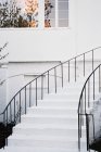 White walls and a curved exterior staircase — Stock Photo
