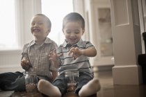 Children playing with coins — Stock Photo