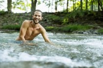 Young man swimming — Stock Photo