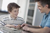 Man and a boy with digital tablet — Stock Photo