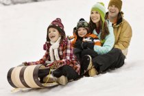 Children sitting on a sledge — Stock Photo