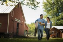 Man and woman in the yard — Stock Photo