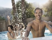 Men and women in the swimming pool — Stock Photo
