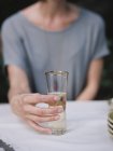 Woman holding a glass — Stock Photo