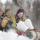Children seated on a sledge — Stock Photo