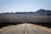 Road across the desert. — Stock Photo