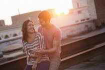 Couple on a rooftop terrace — Stock Photo