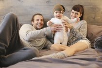 Mother, father and young baby playing — Stock Photo