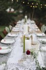Table set with plates and glasses — Stock Photo