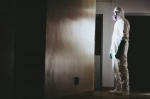 Man wearing protective clean suit — Stock Photo