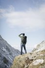 Man hiking and looking at the view. — Stock Photo
