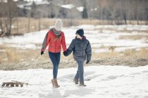 Brother and sister in the snow — Stock Photo
