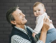 Grandfather and baby granddaughter — Stock Photo