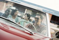 Friends in convertible car on a road trip. — Stock Photo